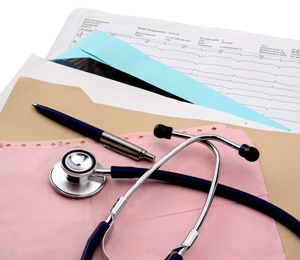 File and paperwork for patient information, pen, and stethoscope